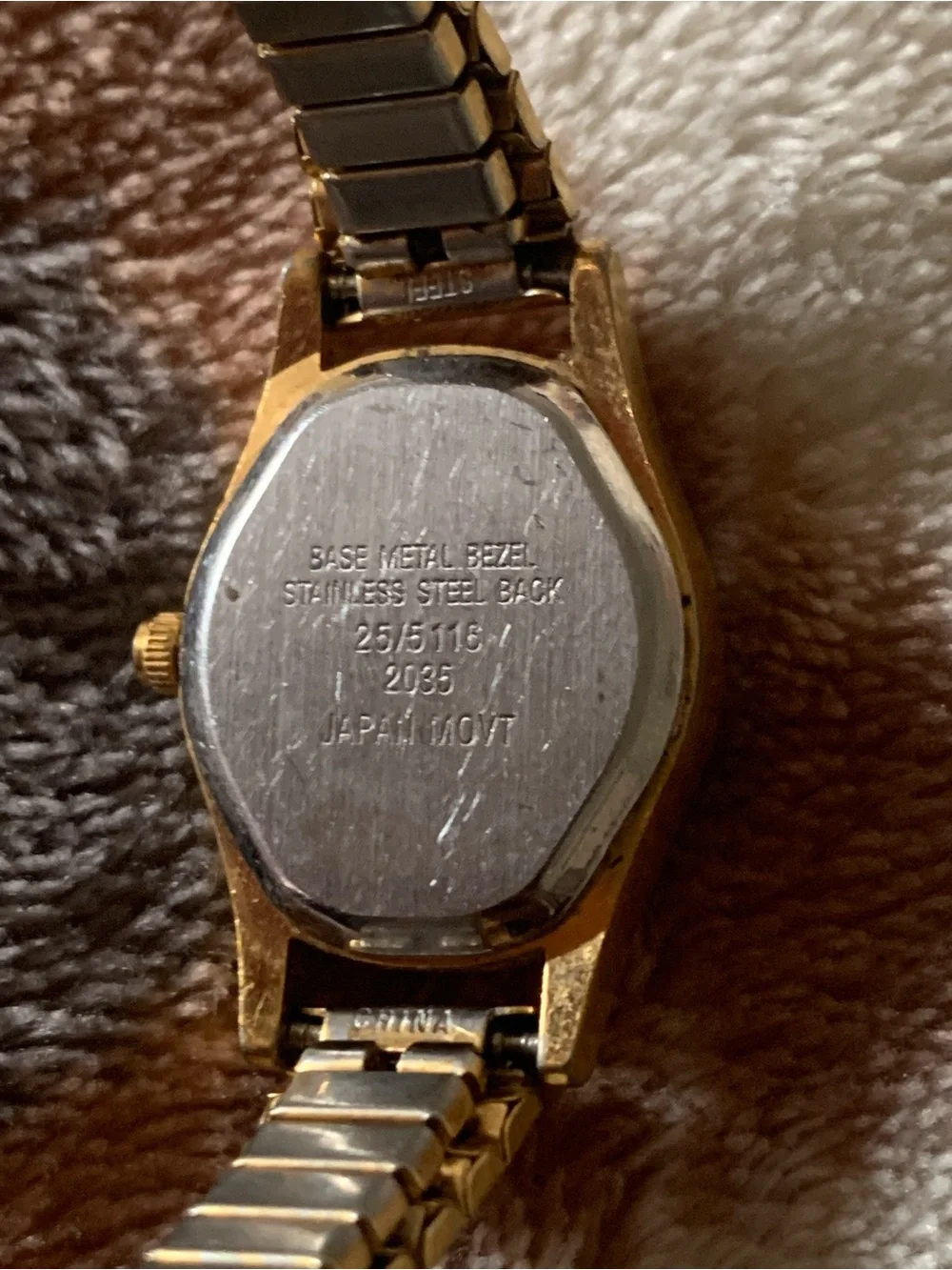 Armitron gold tone with black dial womens watch on stretch bracelet